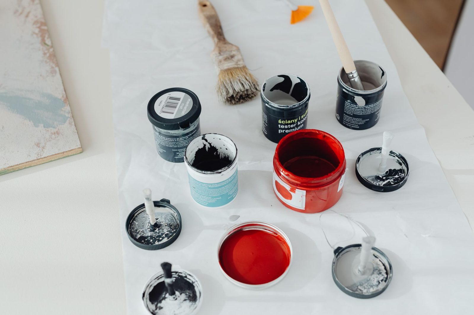 Open paint pots and brushes
