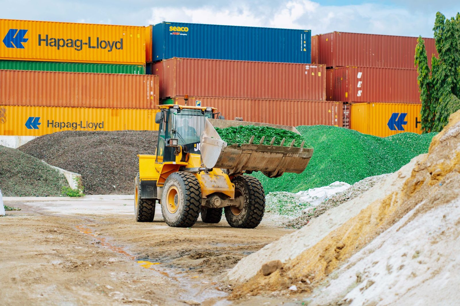 Loader moving rubbish at a waste site